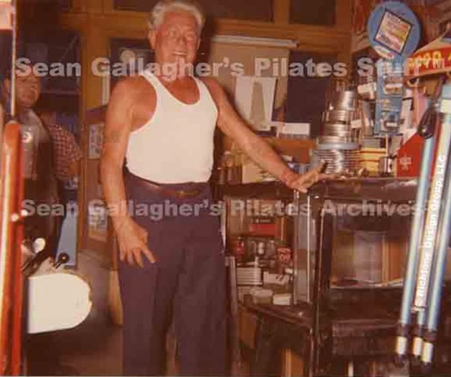 Joseph Pilates inside a camera shop